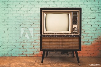 Bild på Retro old television in vintage wall pastel color background